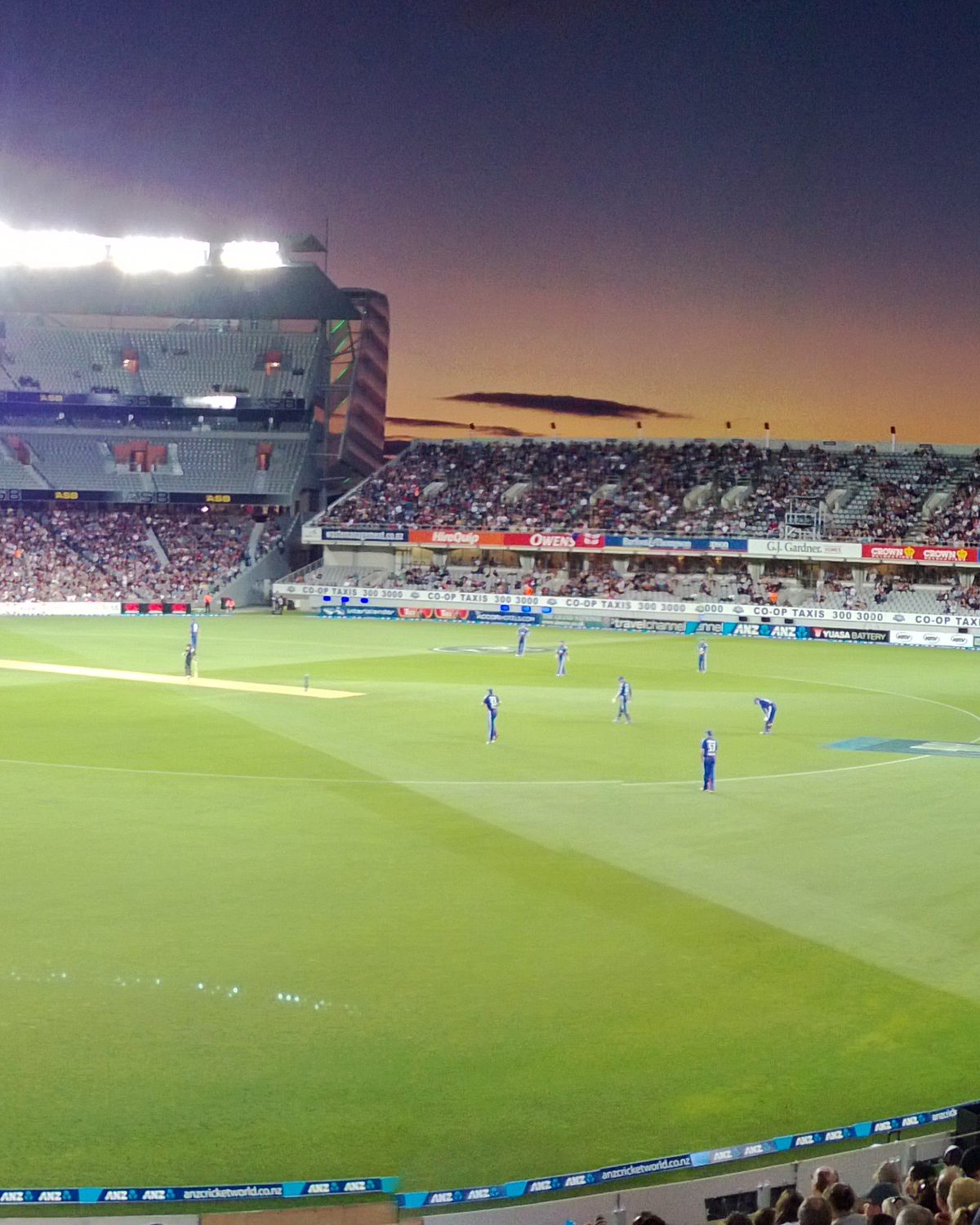 Eden Park stadium under floodlights at dusk, Auckland