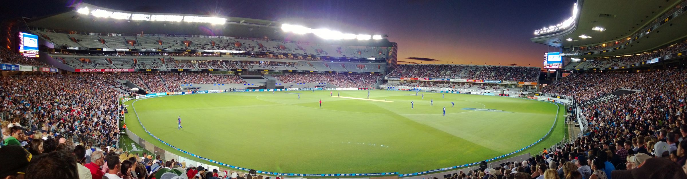 Panorama of a full Eden Park at dusk during a T20 match, Auckland
