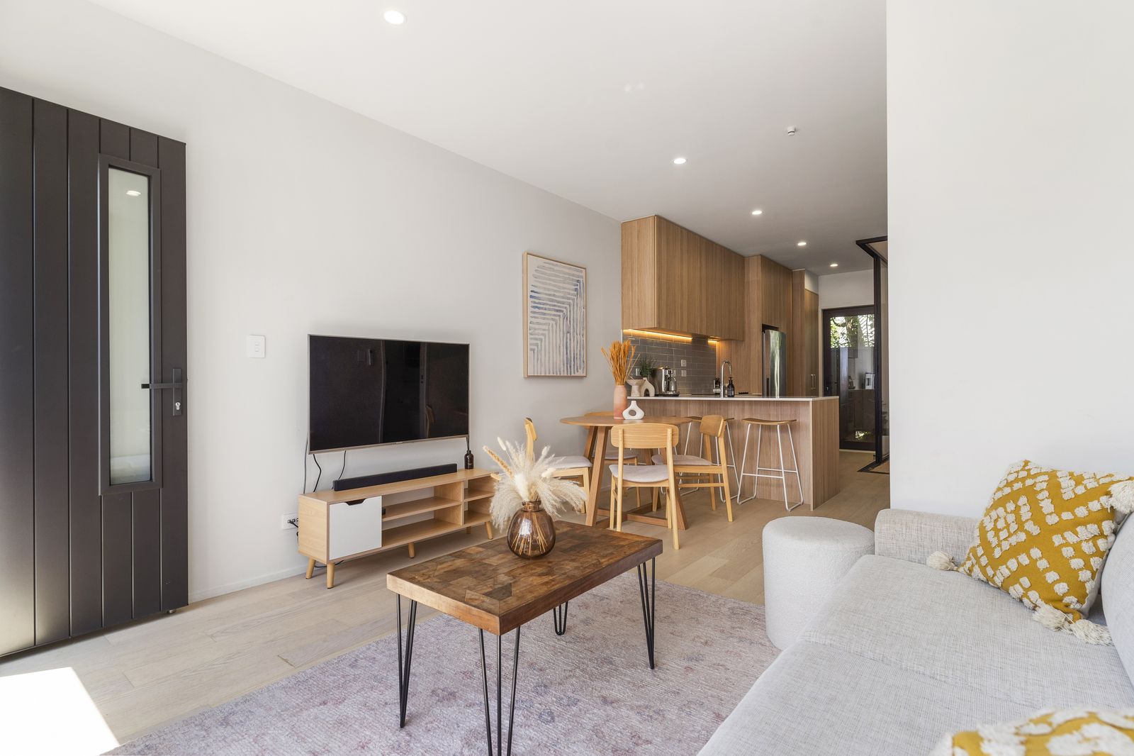 Open-plan lounge and dining at The Fern, Mount Albert